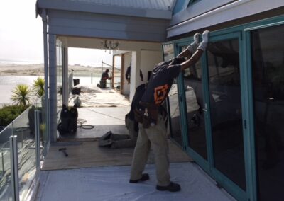 Original single glazed doors being removed